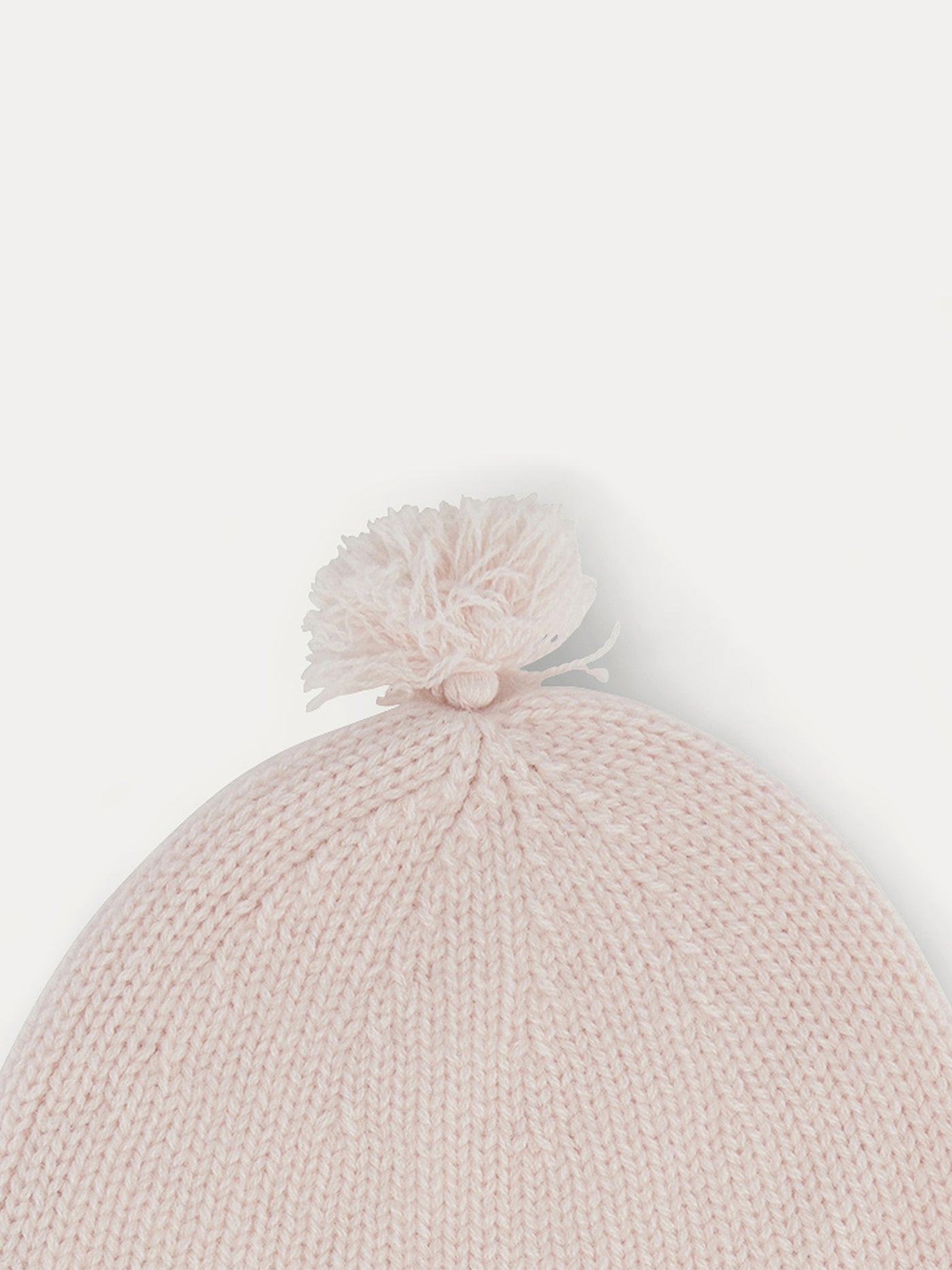 Bonnet bébé rose pâle en cachemire avec pompons
